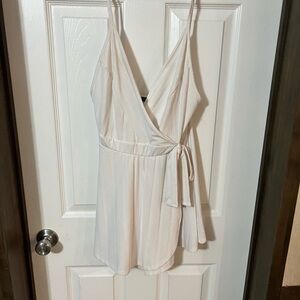 Cream Wrap-Style Jumpsuit with Spaghetti Straps and Tie Waist